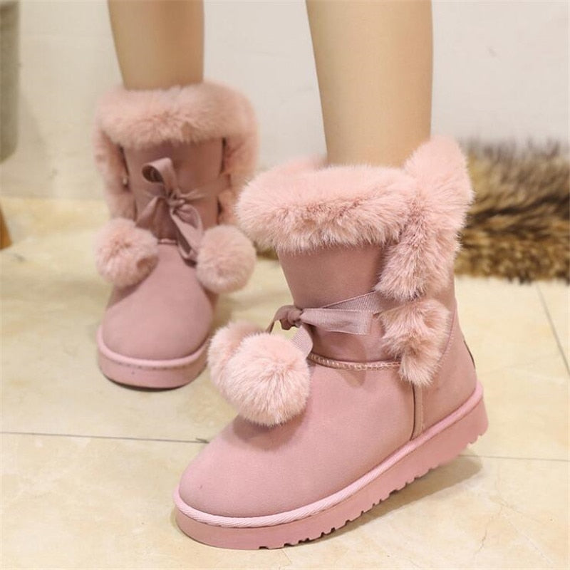 Pelzige rosa Winterstiefel