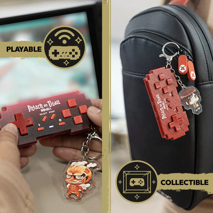 Attack on Titan mini controller being played and clipped to a backpack with character keychains
