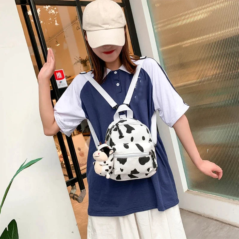 Mini Canvas Daypack With Plush Cow Pendant Cow Print Backpack Adorable Backpack For Women Lady Girls Outdoor Travel Shopping (white)(1pcs)